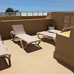 Adosado En *